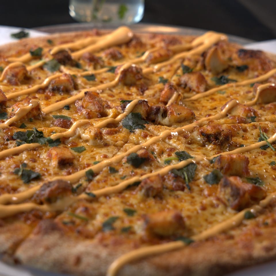 Pizza with sauce drizzle